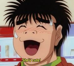 a young man with black hair laughing and the words she's cute on his face