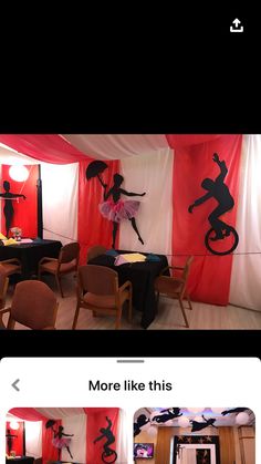 a room decorated with red curtains and black silhouettes