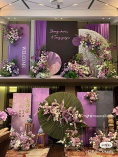 the display is decorated with purple and white flowers