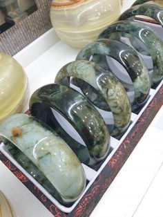 Selected 7 piece collection of domed, wide cut Jade bangle bracelets 🤗! Speckled or veined black-green with water or milky translucency; 0.9 cm thickness, 2.5 cm width and weighs approximately 90 grams a piece. Old pieces from our collection. Bangles in sizes 65 (6.5 cm inner diameter). Listed price is for 1 piece bangle only. Jade Bangle, Pretty Jewellery, Black Green, Bangle Bracelets, 1 Piece, Jade, Jewelry Bracelets, Thailand, Fashion Inspo