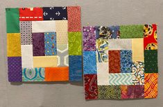 two pieces of colorful quilted fabric on a gray surface with one piece cut out and the other half folded up