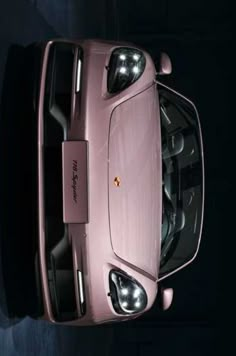 an overhead view of a pink sports car