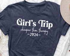 Girls Trip Shirts, Cheaper Than Therapy 2024, Girls Weekend 2024 Shirts, Cheaper Than Therapy 2024, Girls Trip Matching Shirts. A shirt, a fundamental component of one's wardrobe, is a garment that transcends gender and age boundaries. Crafted from a variety of materials, including cotton, silk, or polyester, shirts encompass a wide range of styles, such as T-shirts, dress shirts, and button-downs. Characterized by their upper-body coverage, sleeves, collar, and front openings, shirts epitomize Cheaper Than Therapy, Trip Shirts, Girls Trip Shirts, Summer Graphic Tee, Cheap Shirts, Girls Weekend, Mens Long Sleeve Tee, Travel Shirts, Tailored Shirts