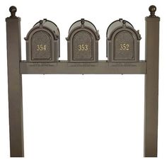 three mailboxes with numbers on them are lined up next to eachother