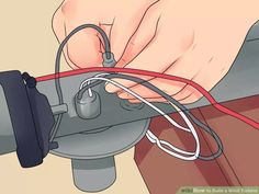 a person is working on an electrical device with wires attached to the ground and plugged in