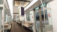 the inside of a train car with lots of glass doors and windows on both sides