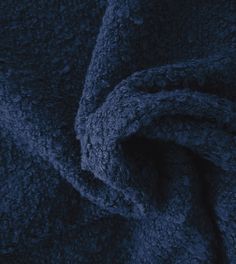 an up close shot of a dark blue blanket