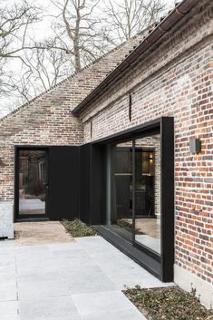 a brick building with glass doors and windows