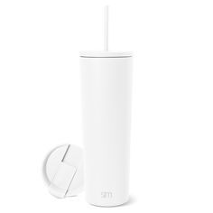 a white tumbler with a straw sticking out of it's top and lid