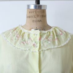 1960's vintage women's pajamas, in a pale yellow color. Lightweight synthetic blend fabric that's a bit see-through / sheer. Pretty floral embroidery detail around the neckline accented with white lace. Comfy, easy to wear style in a 2 piece set. Top is a loose straight cut through body with long fit, button front, short sleeves, and cute pockets. Pants are also a loose cut with elastic waist and straight legs. Machine washable with no issues to note, and has already been cleaned and ready to wear. Pictured on a modern US size small / 4 mannequin for reference but please see all measurements posted below.  ✶ S I Z E ✶ TOP tag size - vintage US women's 34 fits like - modern US women's small bust - 34 waist - measures 19" flat sleeve - 5" shoulder - measures 15.5" seam to seam arm opening - Pockets Pants, Women's Pajamas, Womens Pyjama Sets, Pale Yellow, Embroidery Details, 1960s Vintage, Vintage 1960s, Light Yellow