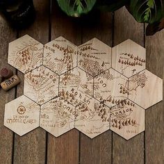 six wooden coasters with the names of different locations on them and some wine corks