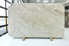 a large white marble slab in a warehouse