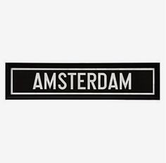 a black and white street sign with the word amsterdam on it's bottom corner