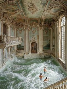 two people are swimming in the water inside an ornate room with painted walls and ceilings