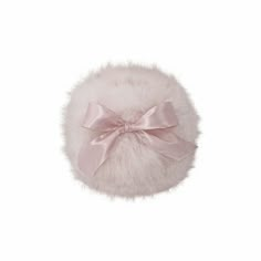 a white fur ball with a pink bow on the front and back of it's head