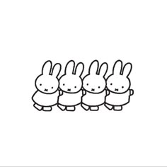 four little bunnies are lined up in the same line, with one bunny's head