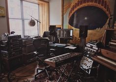 a room filled with lots of musical equipment