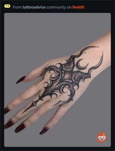 a woman's hand with an intricate tattoo design on the middle of her arm