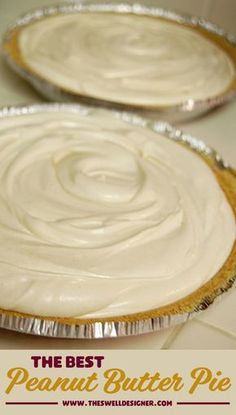 two pies sitting on top of a table covered in frosting