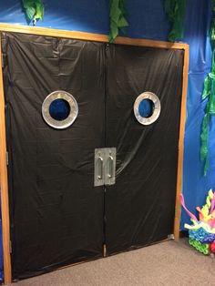 an open door with two round holes in it