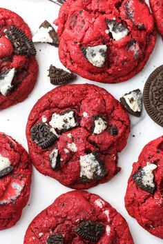 red velvet cookies with oreos and white chocolate chips are on a plate, ready to be eaten