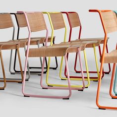 six school chairs with different colors and designs