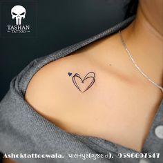 a woman with a heart tattoo on her chest