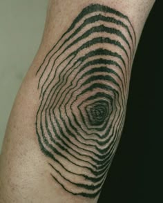 a close up of a person's arm with a finger print on it