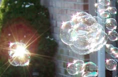 soap bubbles are floating in the air outside