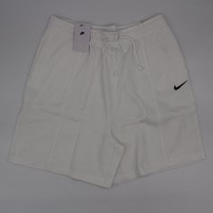 Nike Women's Sportswear Hi Rise Loose Fitwhite Fleece Short Color: White Heavy-Weight Cotton Blend Fleece Cut High Waist Lounge-Ready Fit 2 Side Pockets Machine Washable 80%Cotton, 20%Polyester Elastic And Drawstring Closure Measurement: Us Medium: Waist 32"(Unstretched)/ Rise 14"/Inseam 6.5"/Leg Opening 30"/Outseam 20.5" Measurement: Us Large: Waist 35"(Unstretched)/ Rise 15"/Inseam 6.75"/Leg Opening 30"/Outseam 21.25" Measurement: Us Small: Waist 28"(Unstretched)/ Rise 14"/Inseam 6.25"/Leg Ope Sporty Fleece Sports Shorts, Sporty Fleece Shorts For Sports, Basic White Sports Bottoms, Sporty Drawstring Fleece Sweats, Nike Cotton Sweats For Sports, Casual Fleece Sports Shorts, Nike Solid Activewear For Streetwear, Nike Cotton Athleisure Sweats, Nike Sporty Workout Sweats