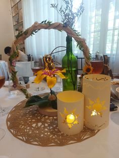 the table is set with candles and flowers