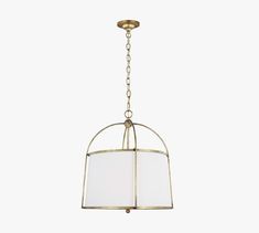 a brass chandelier with a white shade hanging from it's center point