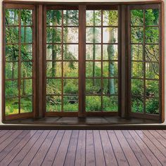 an open window with the view of a forest through it's wooden flooring