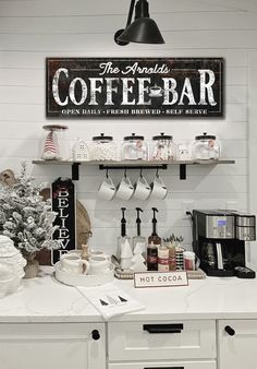 a coffee bar with various items on the counter