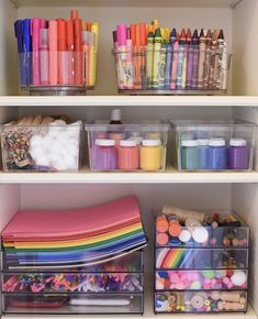 the shelves are filled with craft supplies such as markers, crayons and pencils