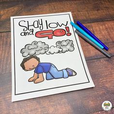 a coloring book with the words stay low and go on it next to a pencil