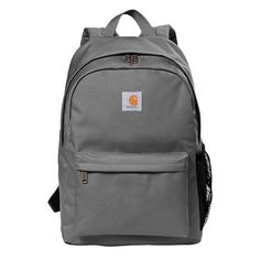 The Custom Printed Carhartt Canvas Backpack is a practical and dependable choice for your daily needs. Crafted from durable canvas with a water-shedding coating, it can withstand the rigors of work or school commutes. With a large main compartment, front zippered pocket, and various mesh pockets, this backpack offers ample storage and organization. Padded shoulder straps ensure comfort during extended wear, and the Carhartt label sewn on the front adds a touch of rugged style. Personalize it wit Carhartt Backpack, Carhartt Bag, Grey Backpack, Laser Engraved Leather, Plaid Dog Bandana, Rugged Style, Laptop Rucksack, Travel School, Herschel Heritage Backpack