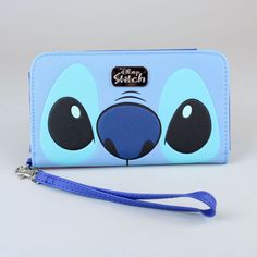 a blue wallet with an animal face painted on the front and bottom, along with a lanyard strap