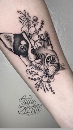 a black and white cat with flowers on its head is shown in this tattoo design