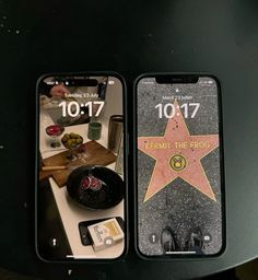 two iphones sitting on top of a table next to each other with the star on them