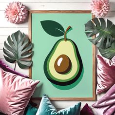 an avocado on a green background surrounded by pink pillows and monster plant leaves