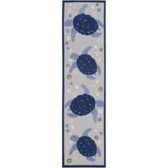 a blue and white rug with two turtles on it