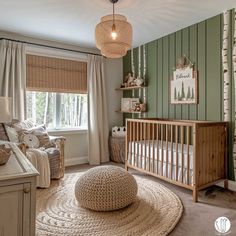 a baby's room with green and white striped walls, a crib, rocking chair, and large round rug