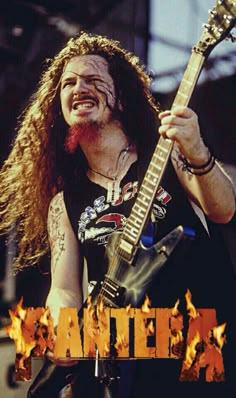 a man with long hair holding a guitar in front of fire and the words alter on it