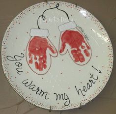 a plate with two handprints on it that says, i love my heart