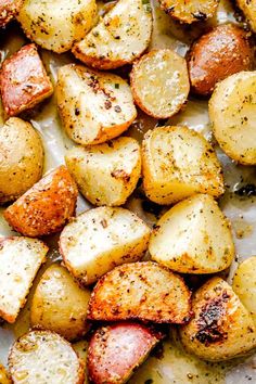 roasted potatoes on a baking sheet with seasoning