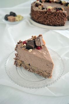 two slices of chocolate cheesecake on glass plates