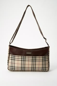 A super cool Burberry crossbody bag made from the iconic Burberry check with brown leather trim, this style is timeless and minimal. Inside there is a zipped compartment for your valuables. In overall good condition, with minor signs of wear to the leather. Height: 19cm Width: 33cm Depth: 7cm Strap drop: 35-55cm Burberry Crossbody Bag, Cool Bag, Webbing Strap, Bag Collection, Vintage Burberry, Burberry Handbags, Vuitton Bag, Casual Backpack, Luxury Life