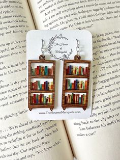 Book Earrings| Bookshelf Earrings| Reader Gifts| Book Earring Dangle| Book Club Gifts| Librarian Gift by thehouseofmarigolds on Etsy https://www.etsy.com/listing/1415975635/book-earrings-bookshelf-earrings-reader Bookshelf Earrings, Book Club Gifts, Reader Gifts, Ears Pierced, Gifts Book, Weird Jewelry, Book Earrings, Bookclub Gifts, Earring Dangle