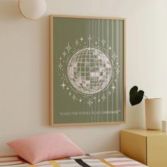 a bedroom with a bed, nightstand and poster on the wall above it that says make this world go somewhere